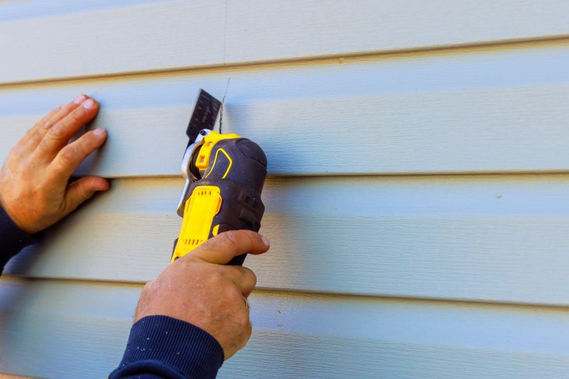 Professional Siding Tools in Use